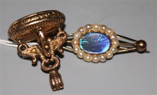An Edwardian gold and split pearl set brooch and a gold plated and carnelian fob seal.